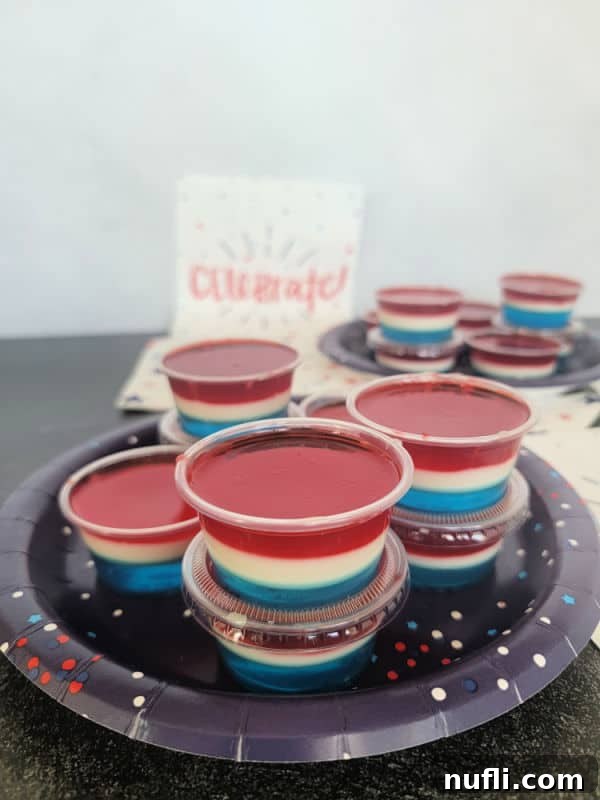 Red White and Blue Jello Shots on a blue plate