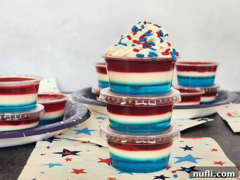 4th of July Red White and Blue Jello Shots stacked together on a star napkin
