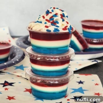 Red white and Blue Jello Shots stacked together on top of a star napkin