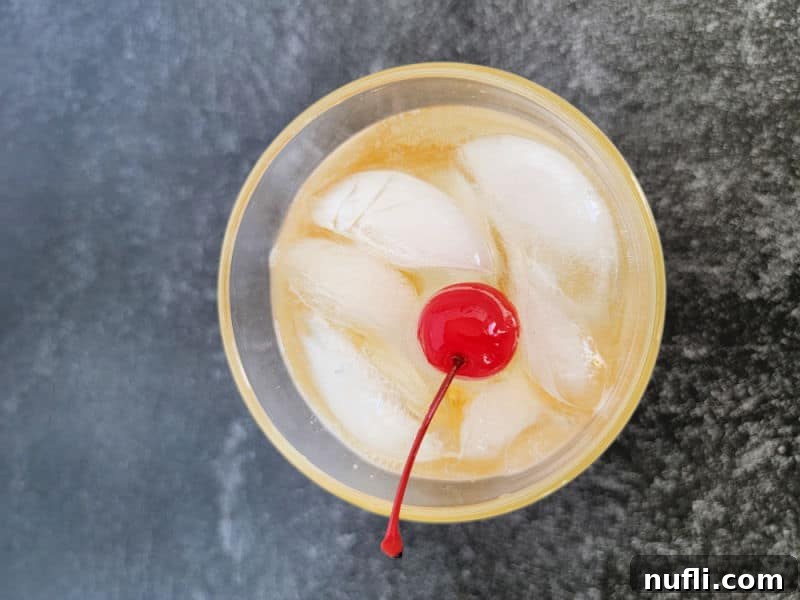 Maraschino Cherry garnish in a Fireball Ginger Ale Cocktail