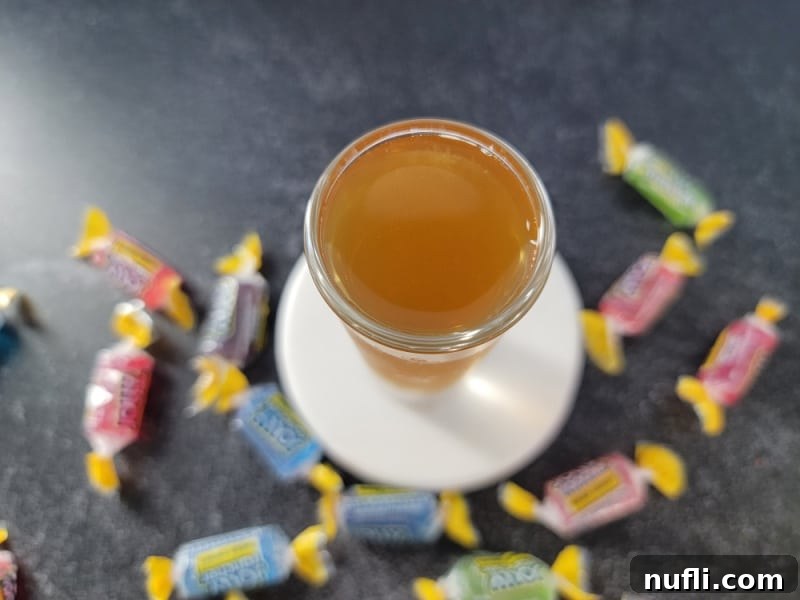 Looking down on a jolly rancher shot surrounded by jolly rancher candies