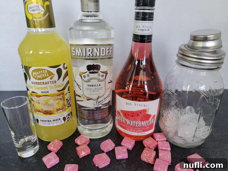 Pink Starburst Shots and Cocktails 3 sweet and sour mix, vanilla vodka, sour watermelon, and a cocktail shaker with pink starburst candy