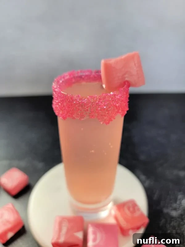 Pink Starburst Shots and Cocktails 7 Pink starburst shot garnished with pink sprinkles and a pink starburst