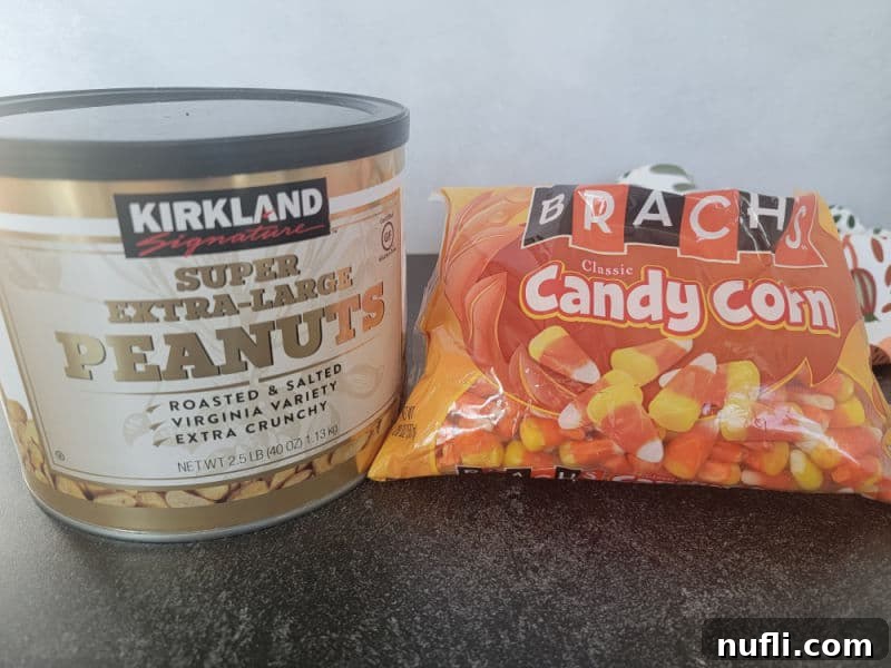 Sweet & Salty Autumn Blend 3 Large can of peanuts next to a bag of classic candy corn