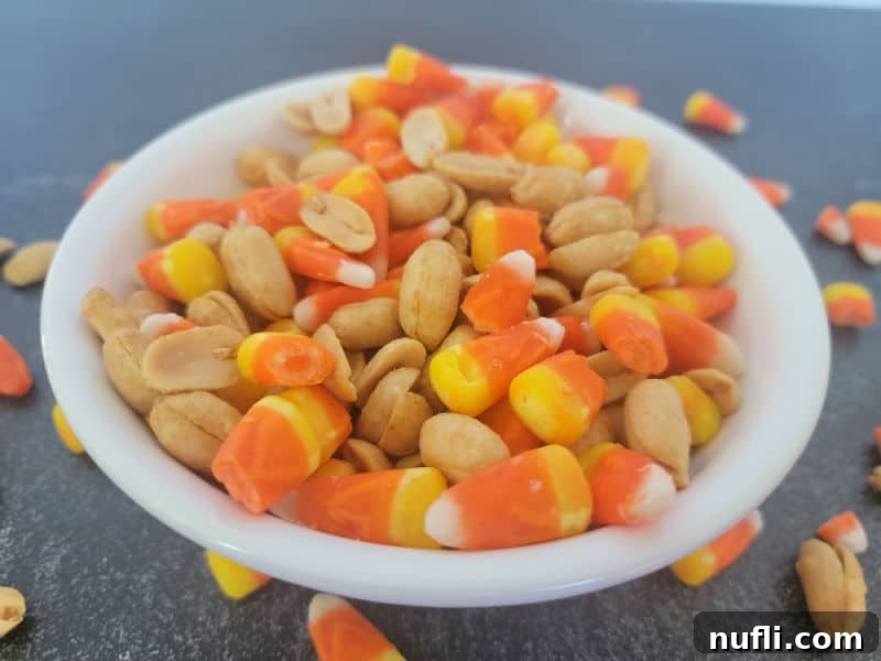 Sweet & Salty Autumn Blend 5 Candy corn and peanuts in a white bowl