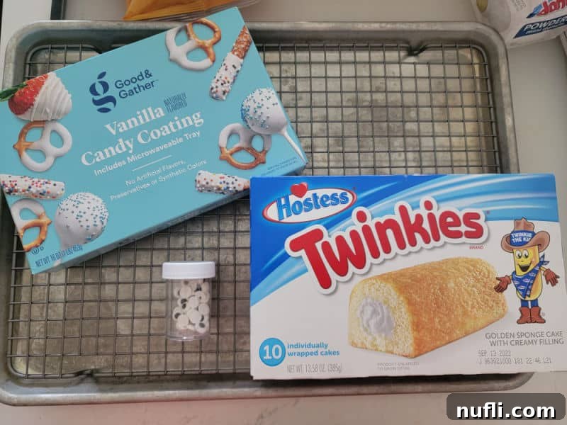 Vanilla candy coating, candy eyes, and a box of Twinkies on a baking pan – the simple ingredients for Mummy Twinkies