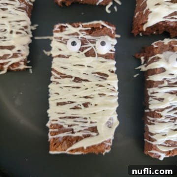 Mummy Brownies on a black plate