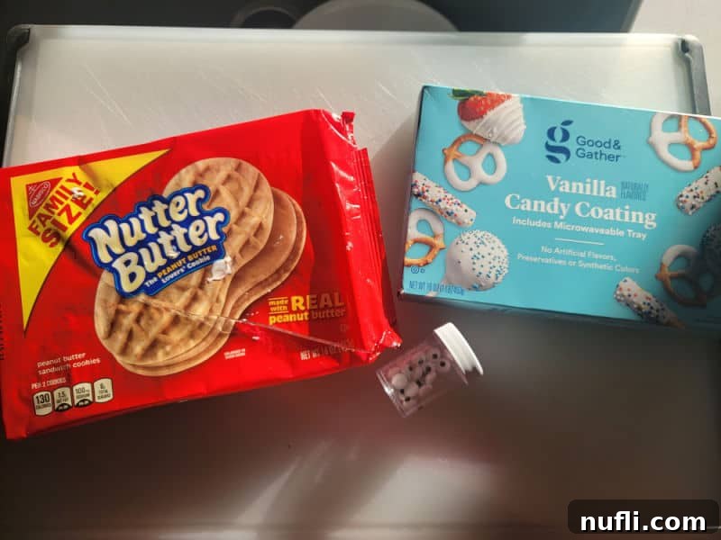 Ingredients for Nutter Butter Mummies: Nutter Butter Cookies, Vanilla Candy Coating, and Candy Eyes
