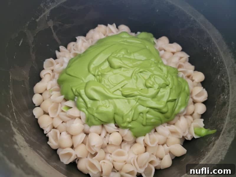 Green cheese sauce on pasta shells