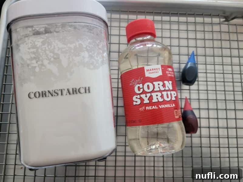 Realistic Edible Blood 3 Edible blood ingredients cornstarch, corn syrup, and food coloring on a wire rack