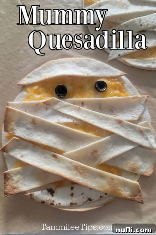 Mummy Quesadilla text over a quesadilla mummy on parchment paper