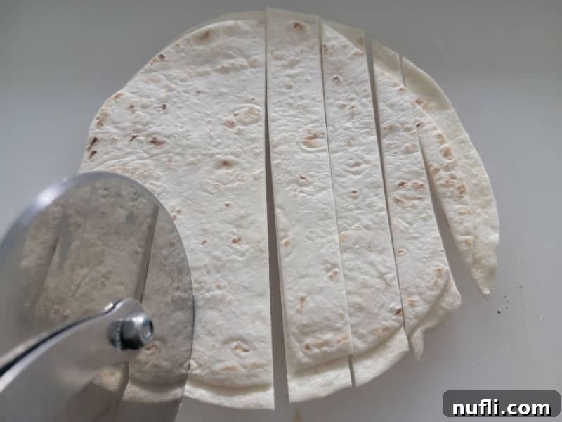 pizza cutter cutting tortillas 