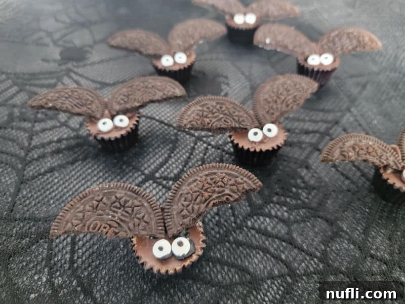 Close-up of several Reese's Bat treats with candy eyes, showcasing their adorable Halloween charm.