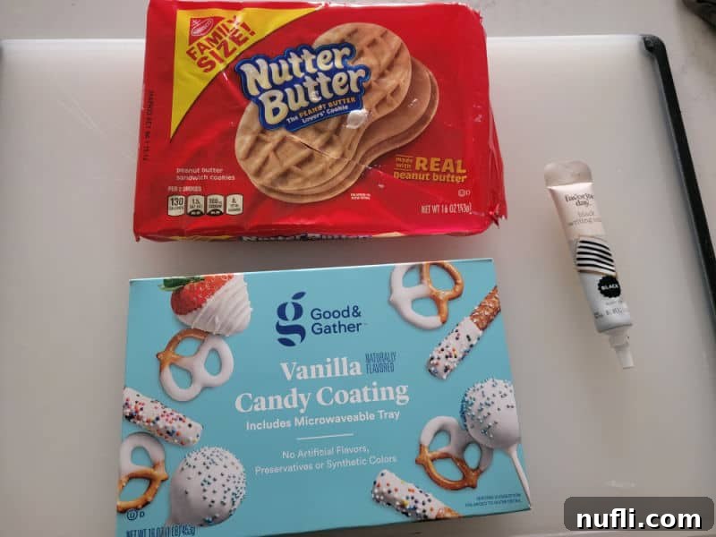 Nutter butter ghost ingredients, nutter butter cookies, vanilla candy coating, black icing pen