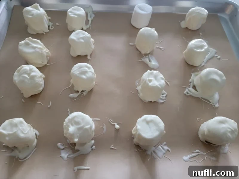 marshmallows coated in candy melt for marshmallow ghosts