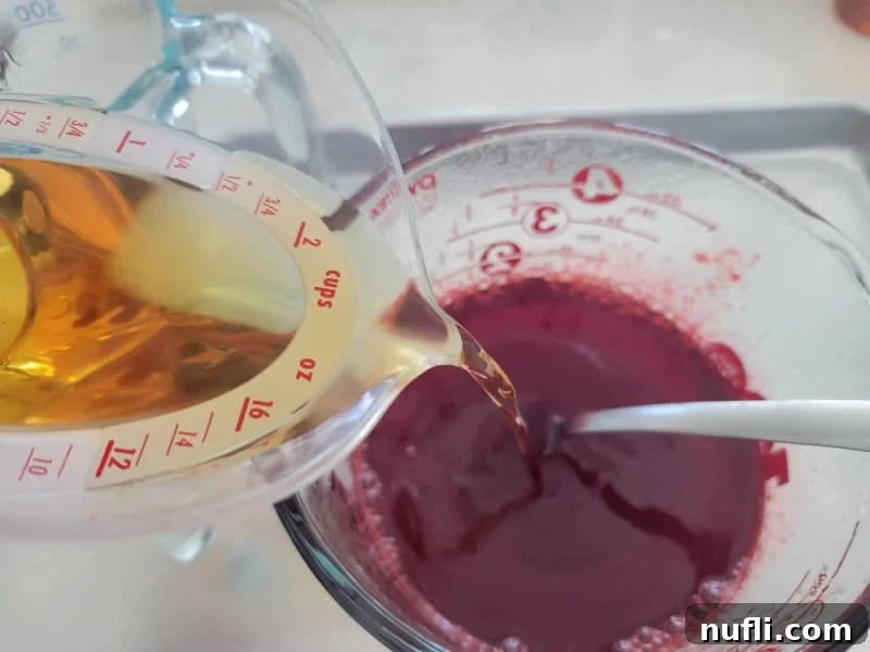 Inferno Jiggle Shots 4 Fireball pouring into red jello for fireball jello shots