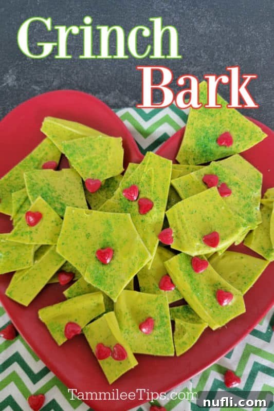 Festive Grinch Bark Made Easy 2 Grinch Bark text printed over a red heart plate with green grinch bark dessert on it.