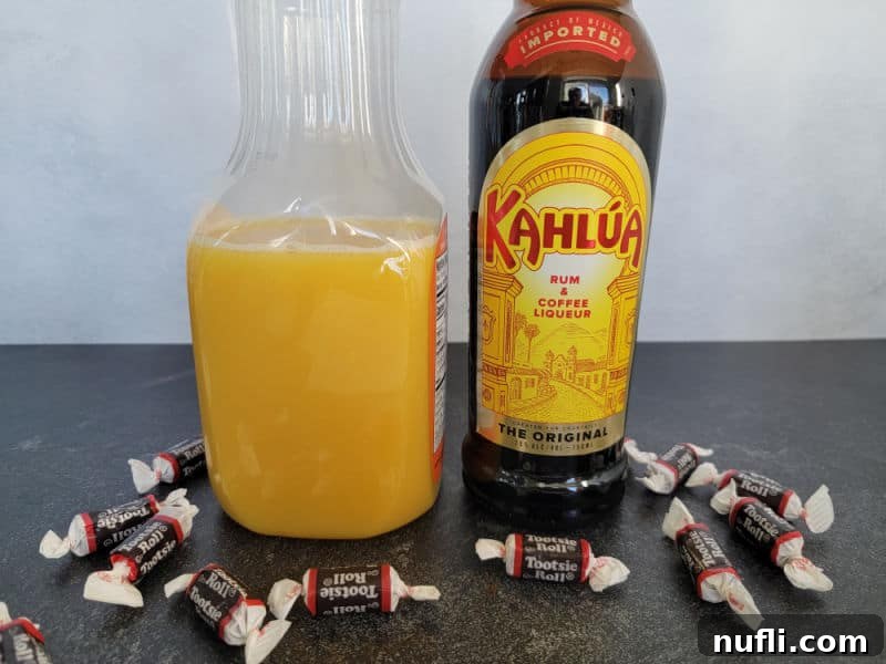 Tootsie Roll Shot ingredients orange juice, Kahlua coffee liqueur and mini Tootsie Rolls