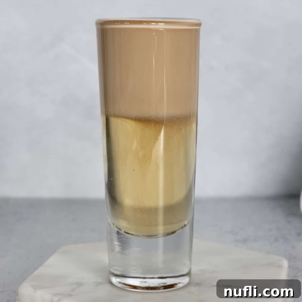 Frangelico Creations 5 Nutty Irishmen Layered cocktail on a marble coaster