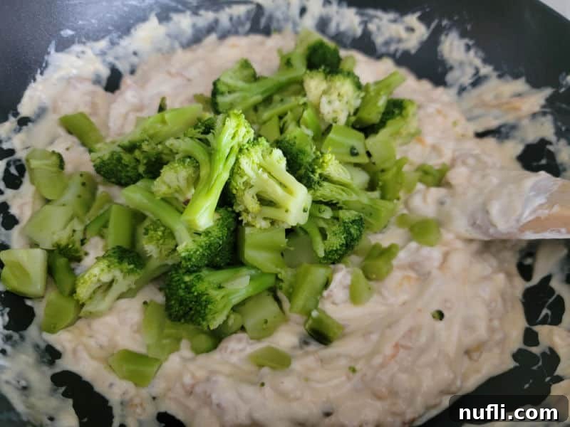 Effortlessly Delicious Broccoli Bake 6 Broccoli Florets mixing into a creamy mixture for Broccoli Casserole