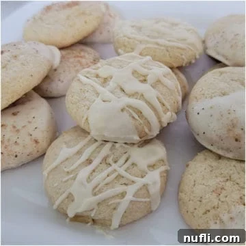 Eggnog cake mix cookies with icing on a white plate