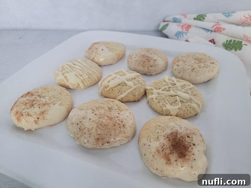 Eggnog cookies with eggnog glaze on a white plate