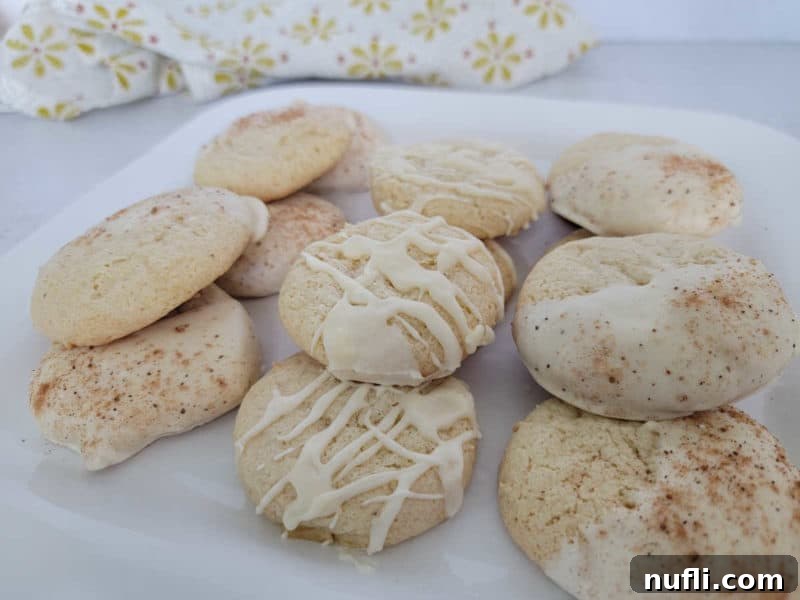 eggnog cookies on a white plate with a cloth napkin