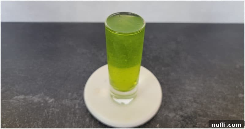 bright green broken down golf cart shot on a coaster