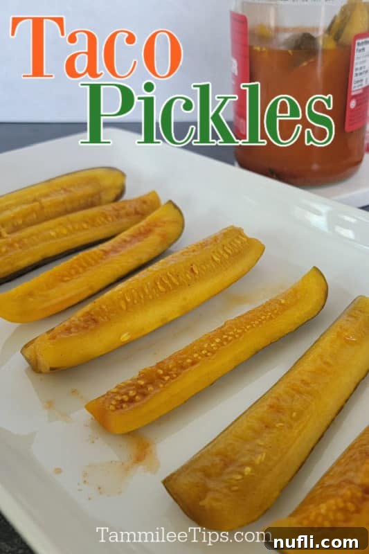 The Two Ingredient TikTok Taco Pickle Sensation 2 Taco Pickles spread out on a white platter with a jar of pickles behind them.