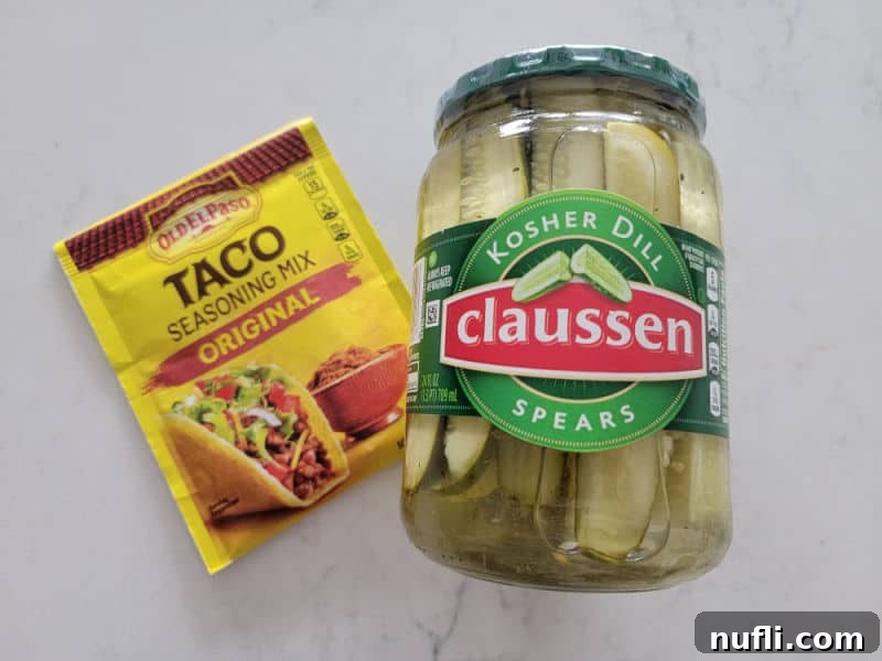 The Two Ingredient TikTok Taco Pickle Sensation 3 TikTok Taco Pickles Recipe Ingredients, taco seasoning and a jar of pickles