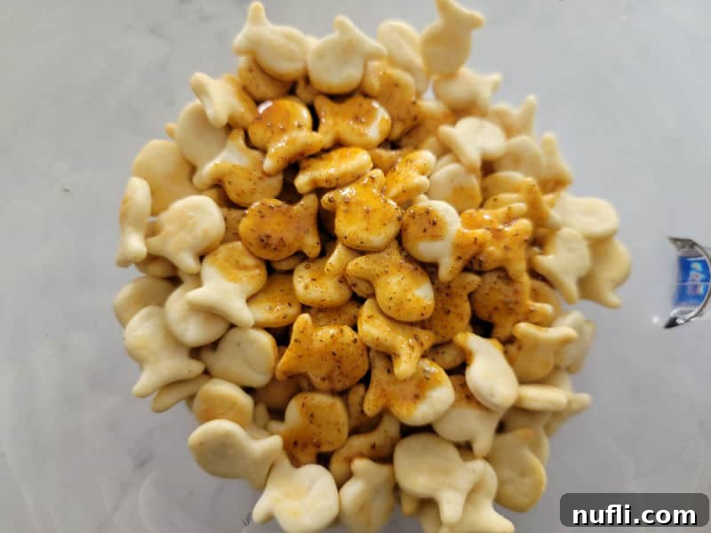 Old Bay Seasoning Butter melted over Goldfish Crackers in a glass bowl