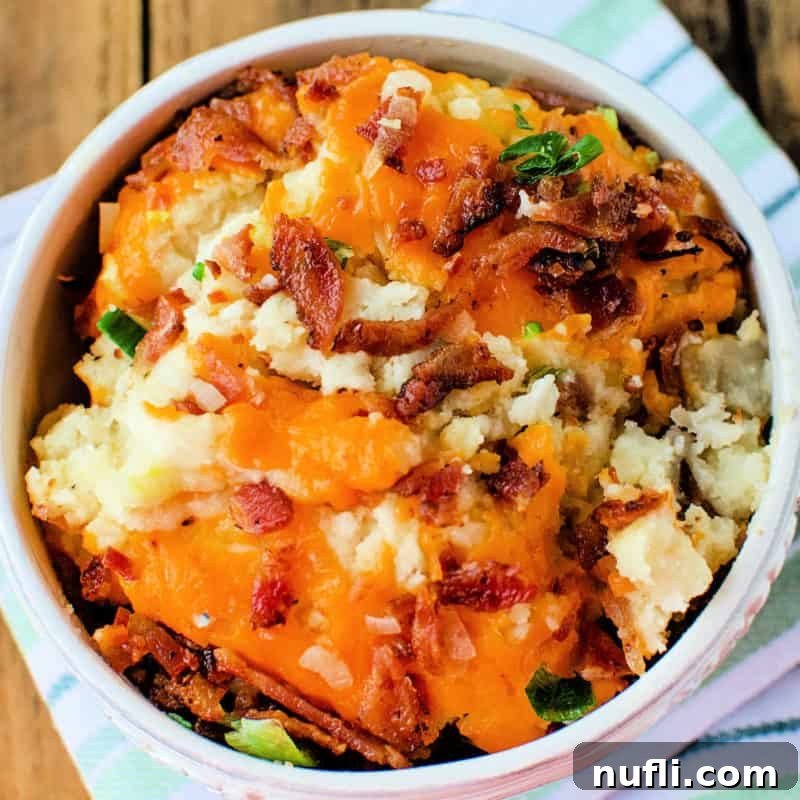 Mashed potatoes loaded with melted cheese and crispy bacon, a true comfort food.