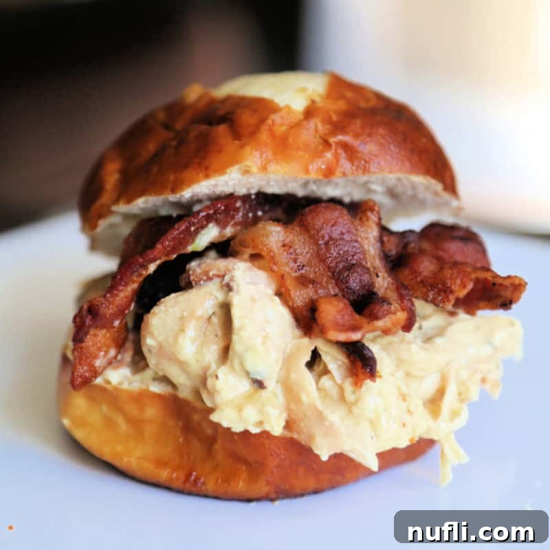 A juicy Bacon Ranch Chicken sandwich served on a pretzel bun.