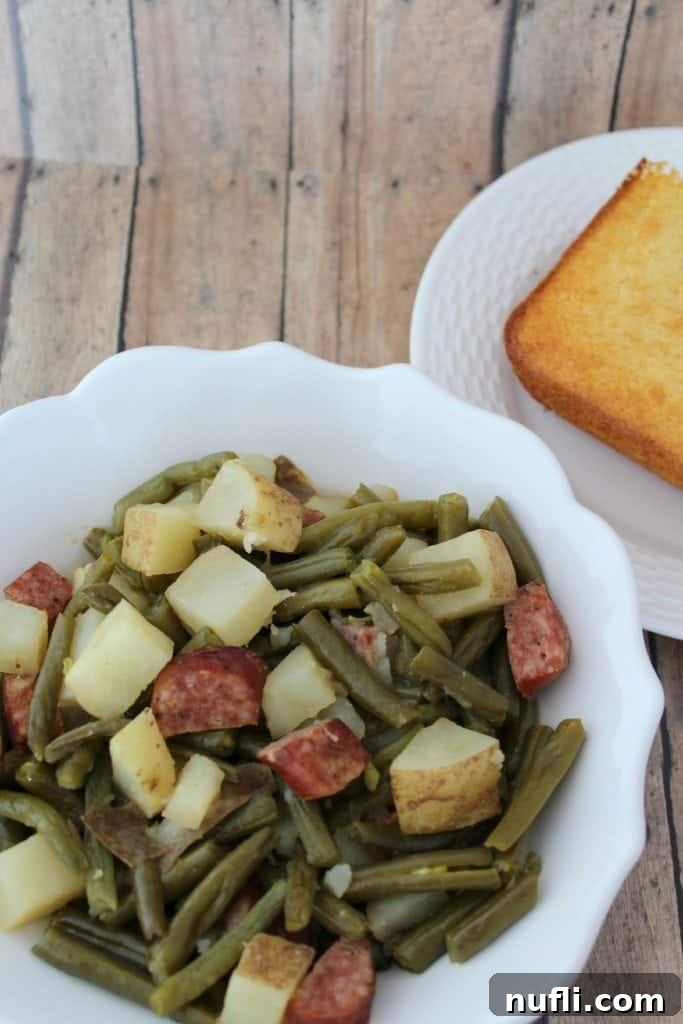 Crockpot Green Beans and Kielbasa is a great family side dish or main meal. So easy to make and a great comfort food