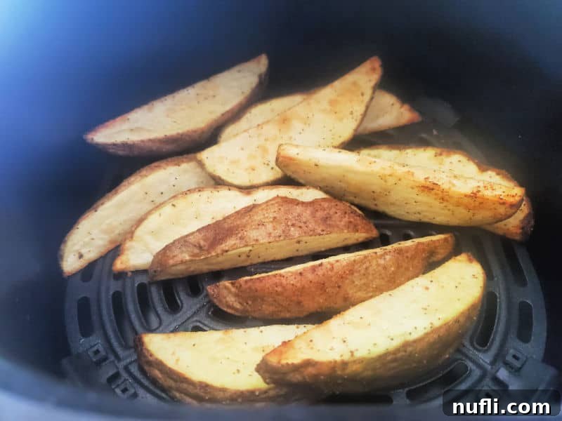 30 Simple Flavorful Vegetarian Air Fryer Dishes 12 Potato wedges in the air fryer basket