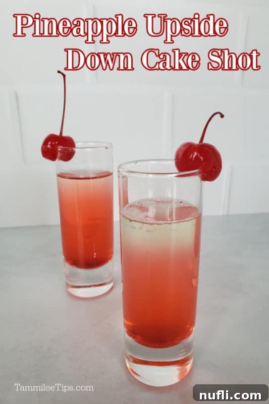 Pineapple Upside Down Cake Shot text over a pink layered shot with maraschino cherry