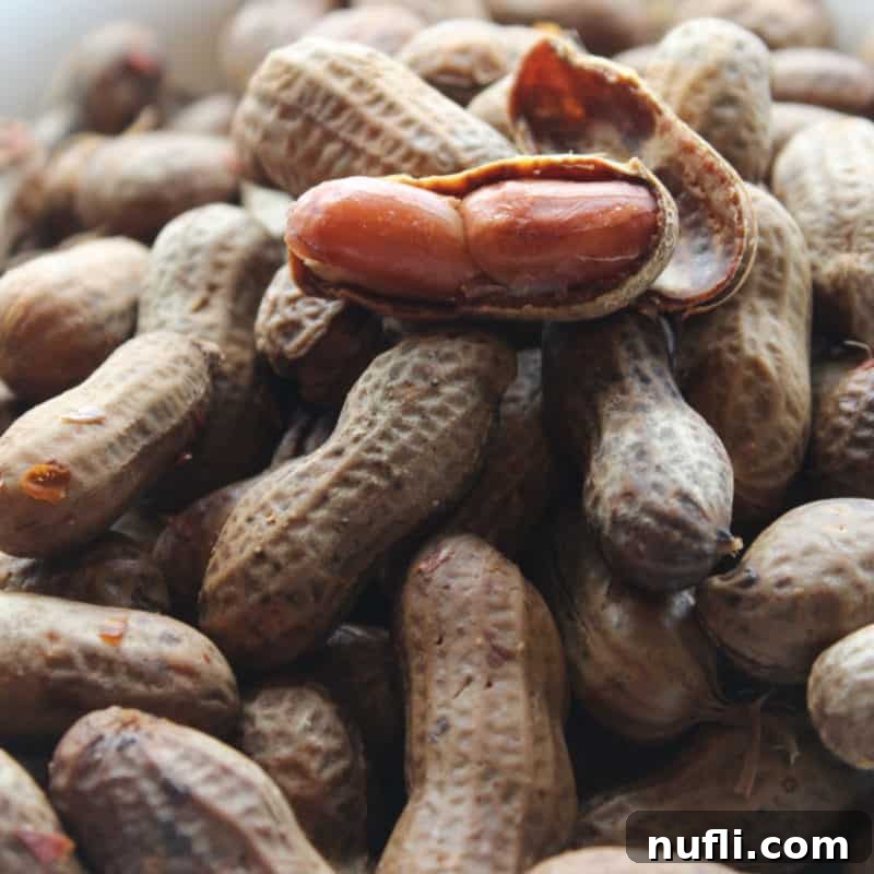 Score Big with These Game Day Appetizers 11 crockpot boiled peanuts stacked on top of each other with one open