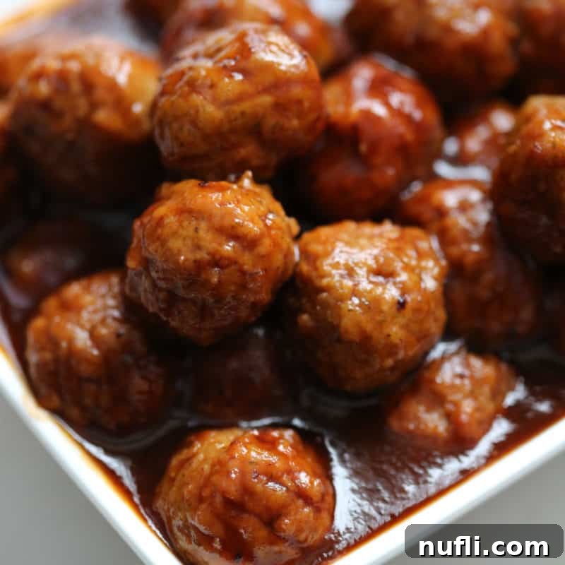 Score Big with These Game Day Appetizers 23 Cranberry Barbecue Meatballs piled in a white bowl