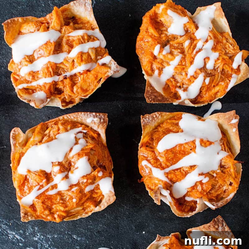 Score Big with These Game Day Appetizers 31 Buffalo Chicken Wontons on a slate platter