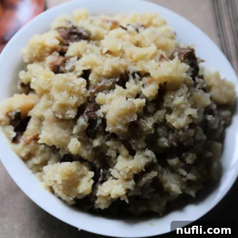 Creamy garlic mashed potatoes in a white bowl, ready to serve