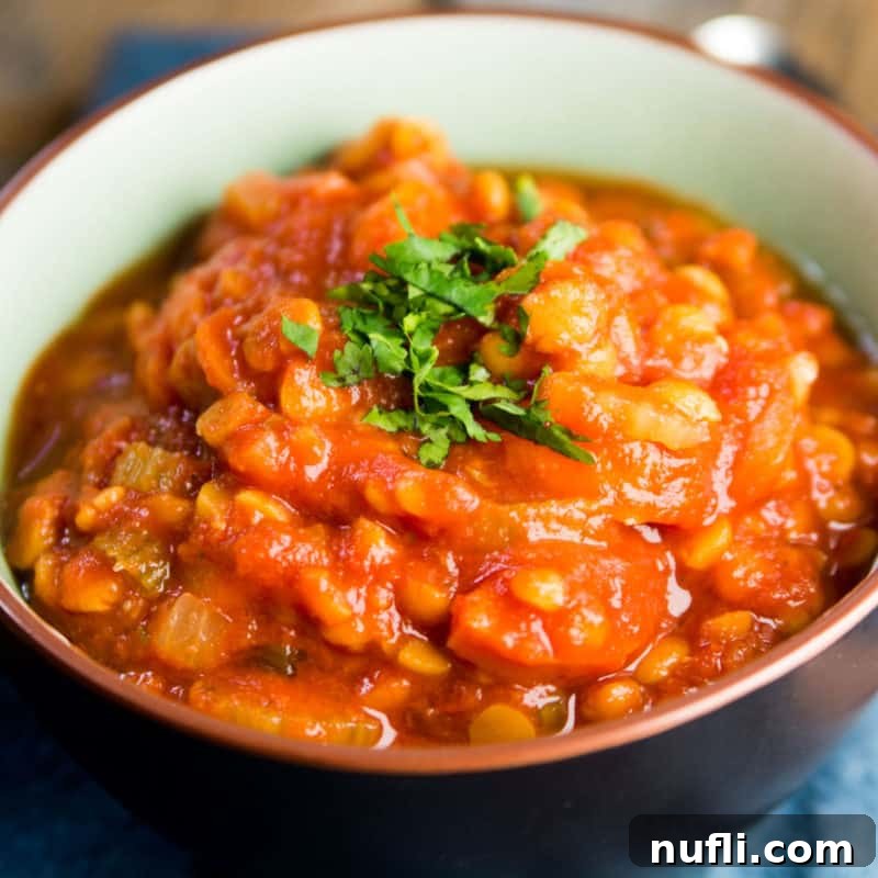 A vibrant bowl of Vegan Lentil Soup, rich in color and texture, offering a wholesome and satisfying plant-based meal.