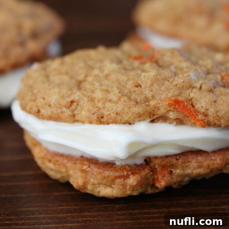 A delectable Carrot Cake Oatmeal Whoopie Pie cookie resting on a rustic wood platter, showcasing its inviting texture and cream cheese filling.