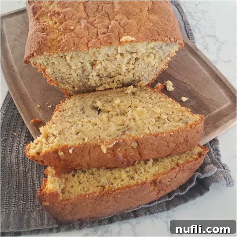 Slices of 3 ingredient banana bread on a wood board