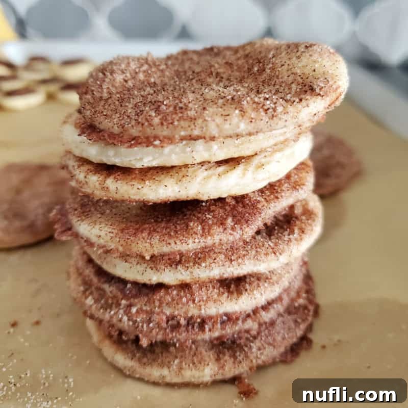 Stack of pie crust cookies on parchment paper
