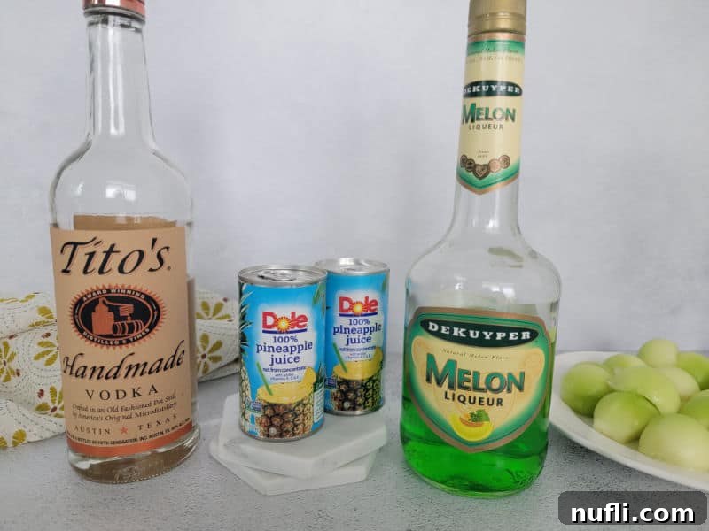 Ingredients for Melon Ball Shot: bottle of vodka, Midori Melon Liqueur, and a can of pineapple juice.