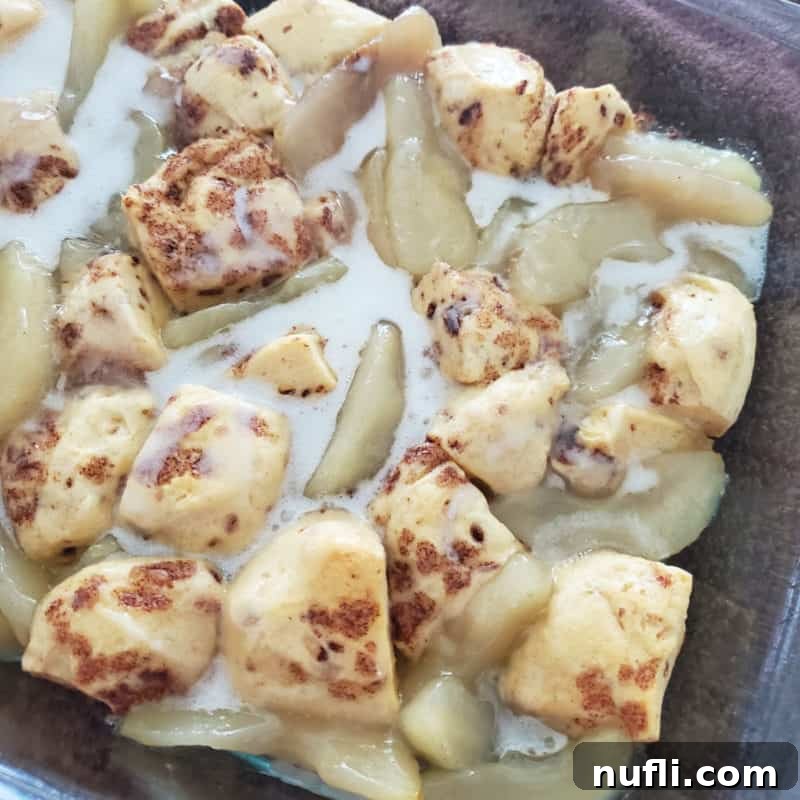 2-Ingredient Cinnamon Roll Apple Cobbler in a glass baking dish