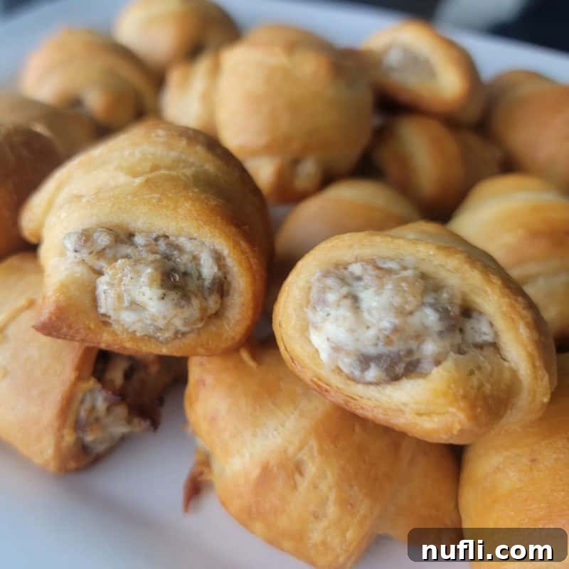 Three Ingredient Feasts Simple Scrumptious 13 Sausage Cream Cheese Crescent Rolls on a white platter
