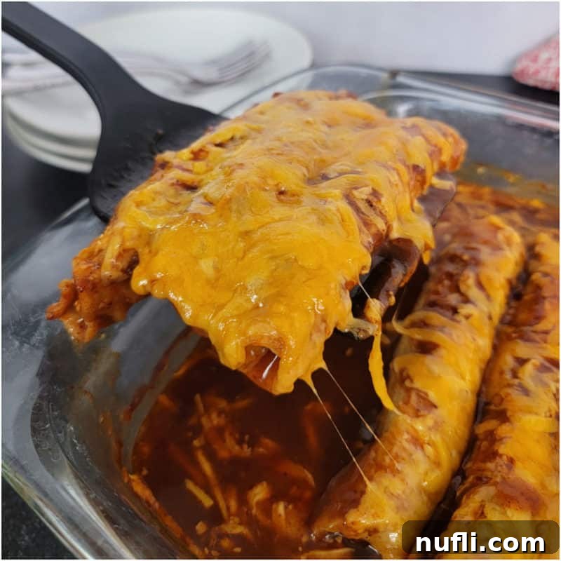 Three Ingredient Feasts Simple Scrumptious 26 Spatula lifting lazy enchiladas out of a glass baking dish