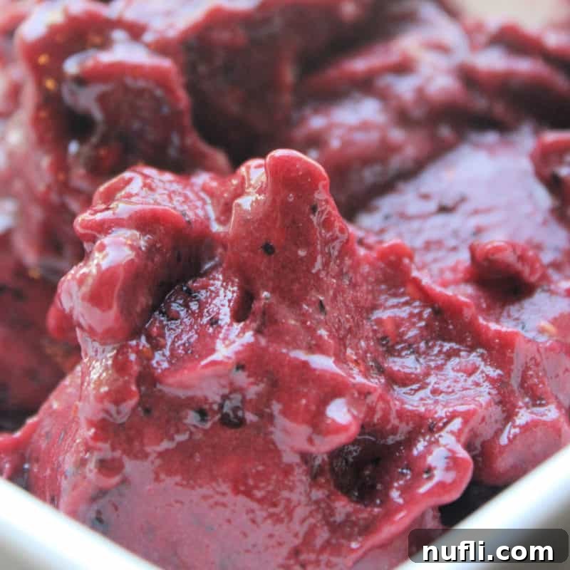 Three Ingredient Feasts Simple Scrumptious 43 Berry Coconut Sorbet in a white bowl