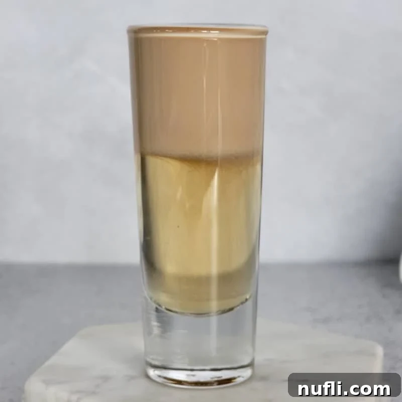 Nutty Irishmen Layered cocktail on a marble coaster